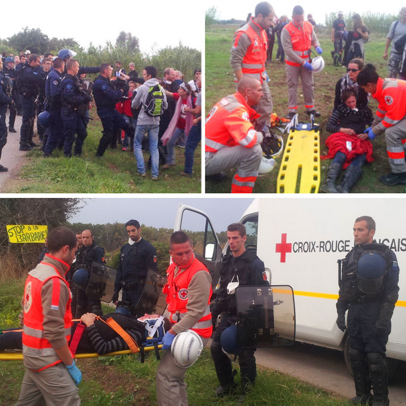 Isabelle évacuée par la Croix Rouge sous les regards gênés des gendarmes, jambe cassée par un coup de pied du gendarme fou et visage brûlé par les lacrymos à bout portant (matricule relevé, plainte en cours)